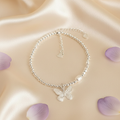 Papillon Perle — Flat Lay on Cream Silk
