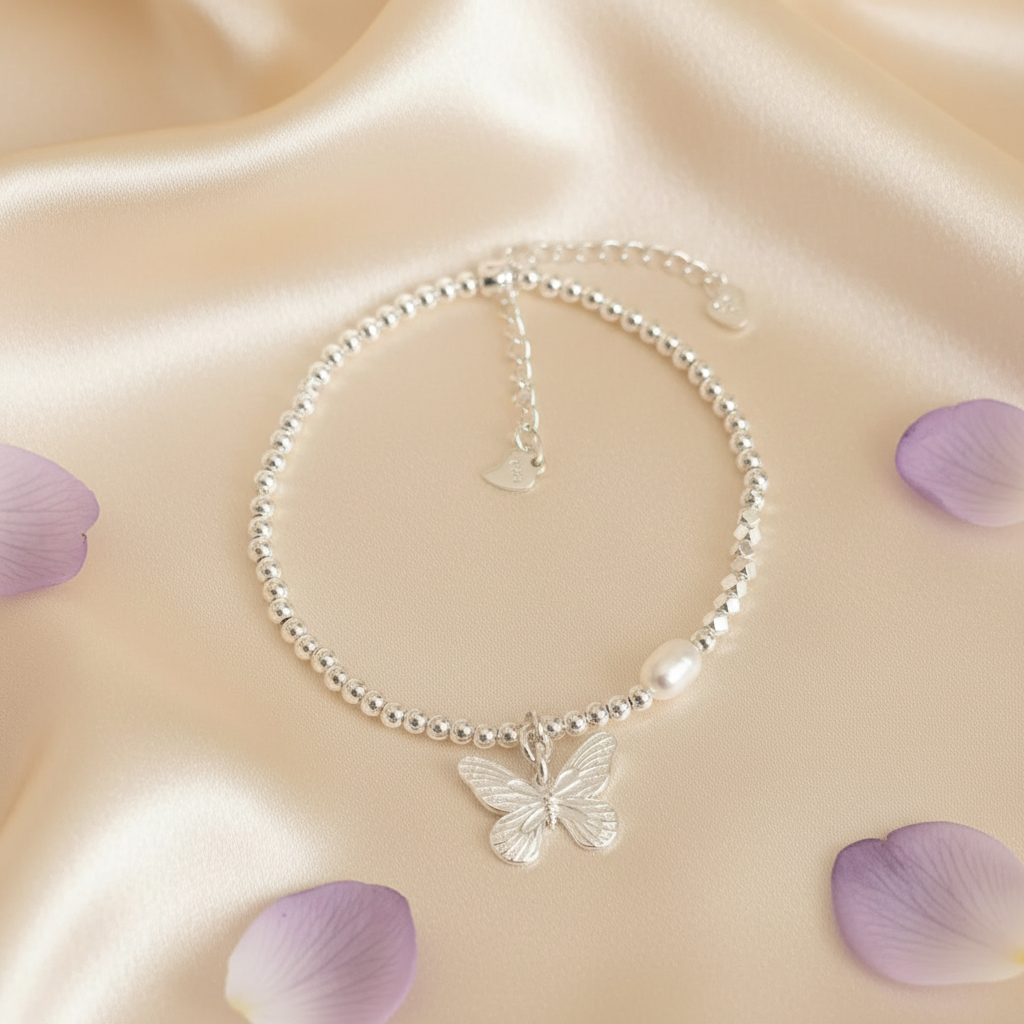Papillon Perle — Flat Lay on Cream Silk