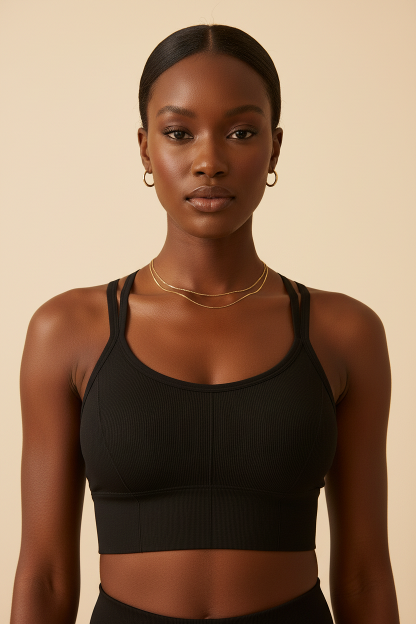 Model wearing black ribbed cross-back sports bra front view