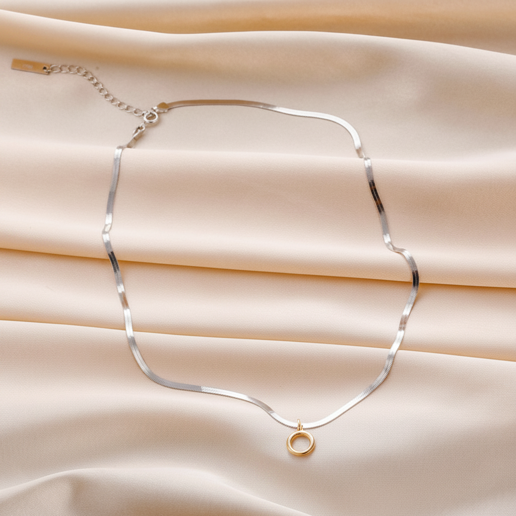 Serpente — Flat Lay on Cream Silk
