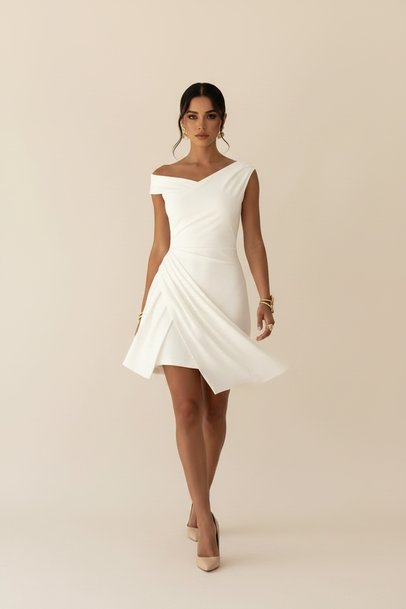 White off-shoulder draped mini dress - walking pose - BYS Boutique