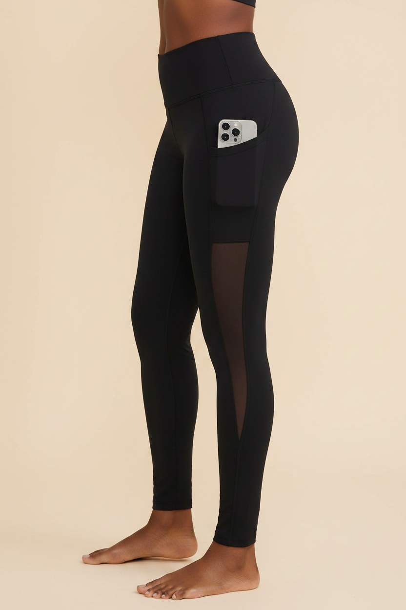 Black mesh panel yoga leggings side view with pocket